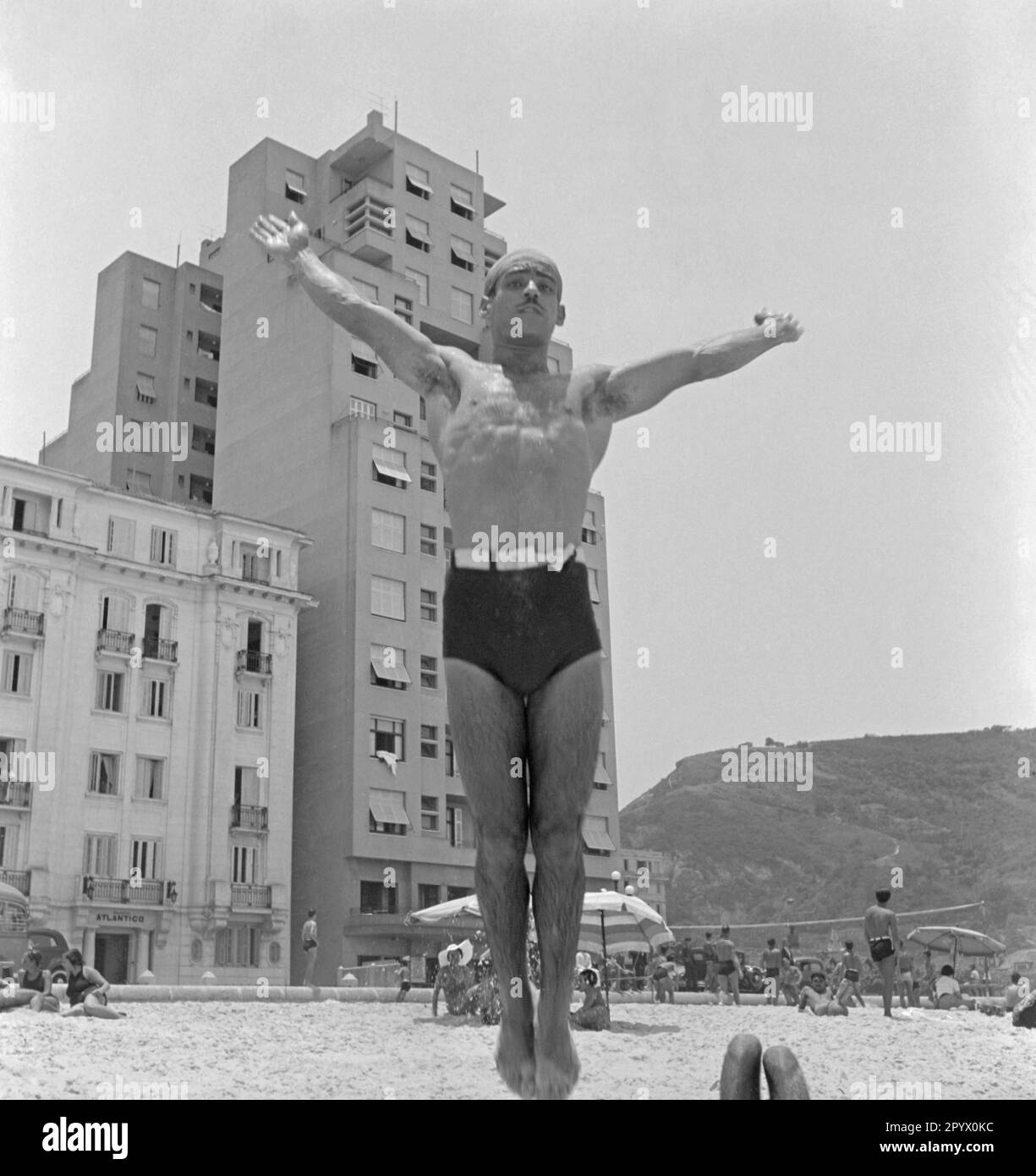 A Brazilian at his acrobatic performance on the beach. In the ...