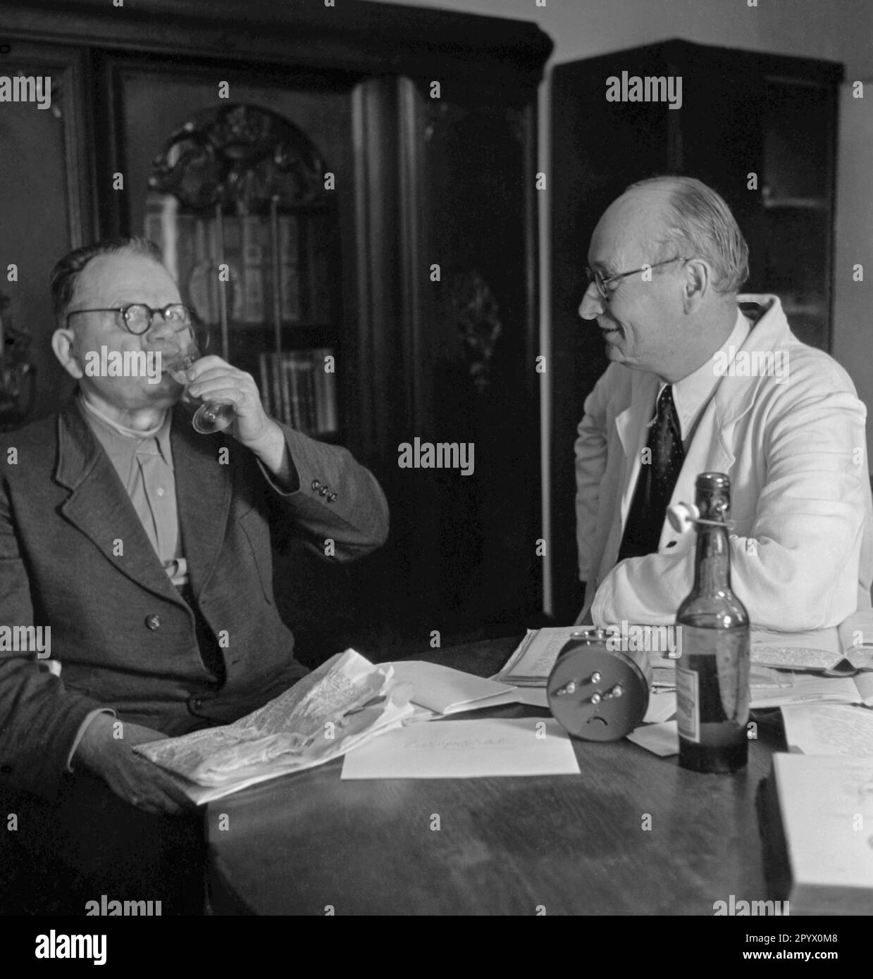 Teaching of deaf-mutes to speak - a sip of schnapps Stock Photo - Alamy