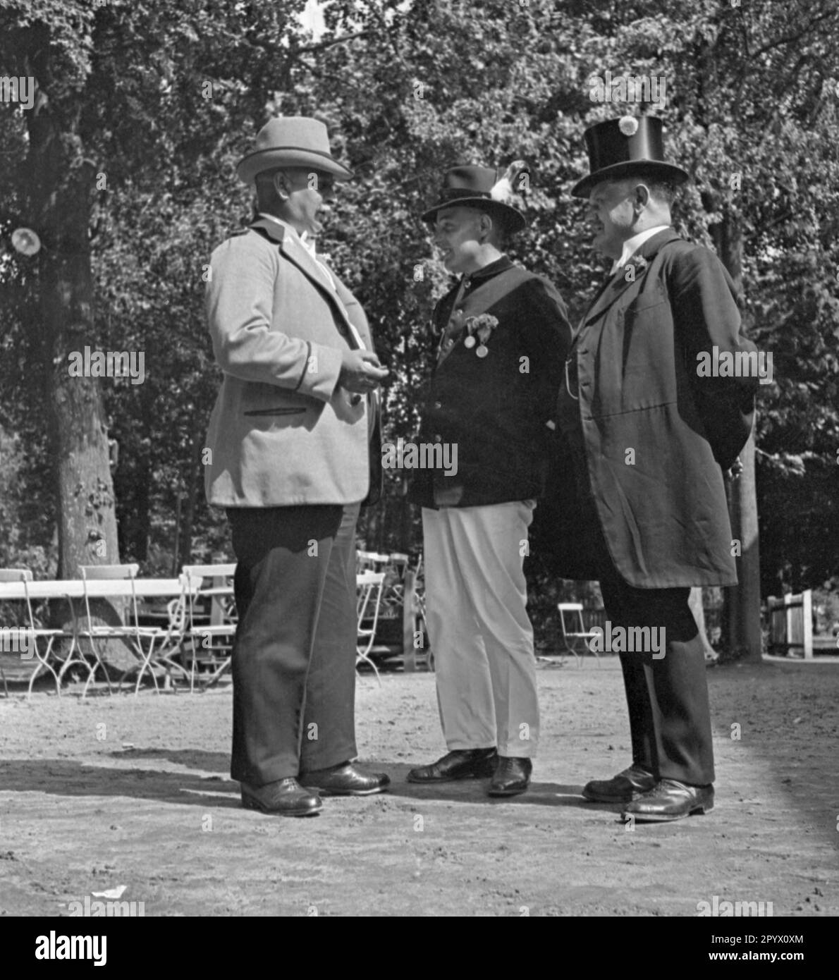 Members of a shooting club from Plau while talking Stock Photo Alamy