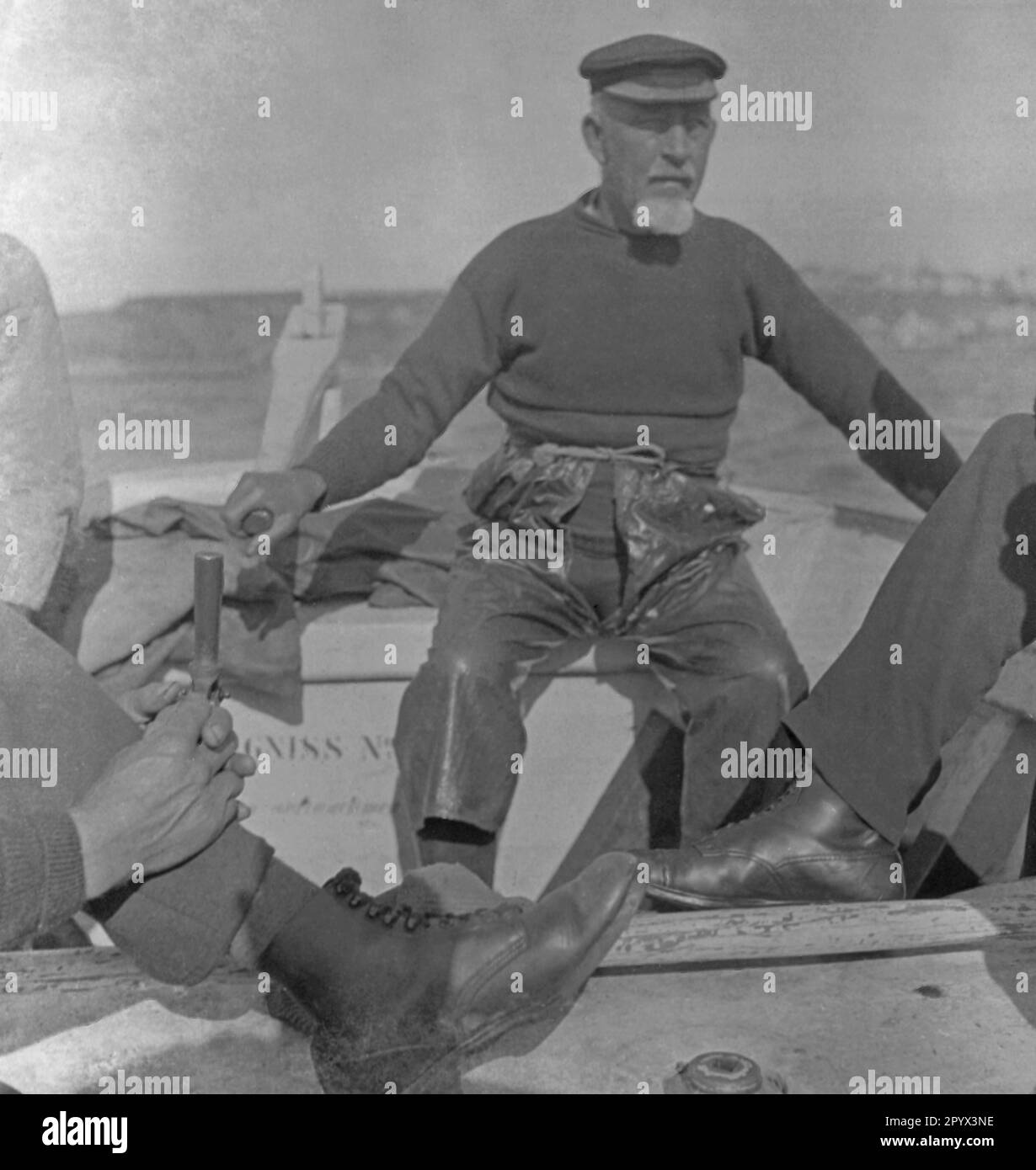 Fisherman wearing a Prinz-Heinrich cap in a boat on the North Sea