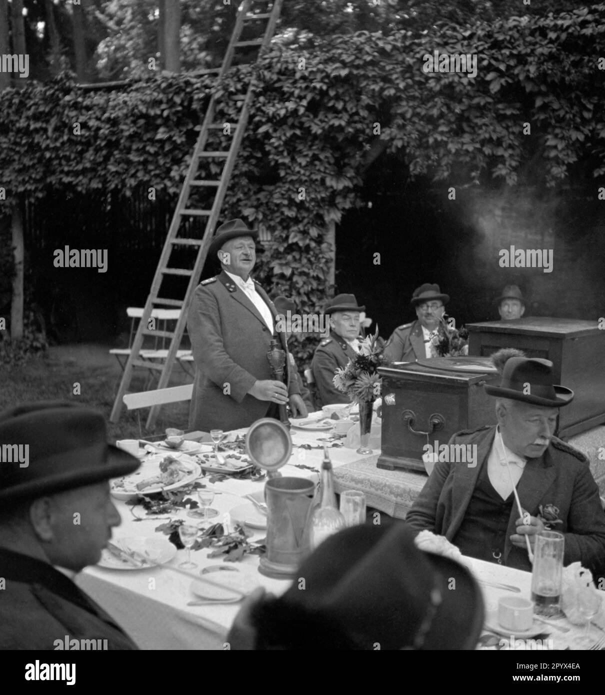 A member of a Rostock shooting club gives a speech at a club party at