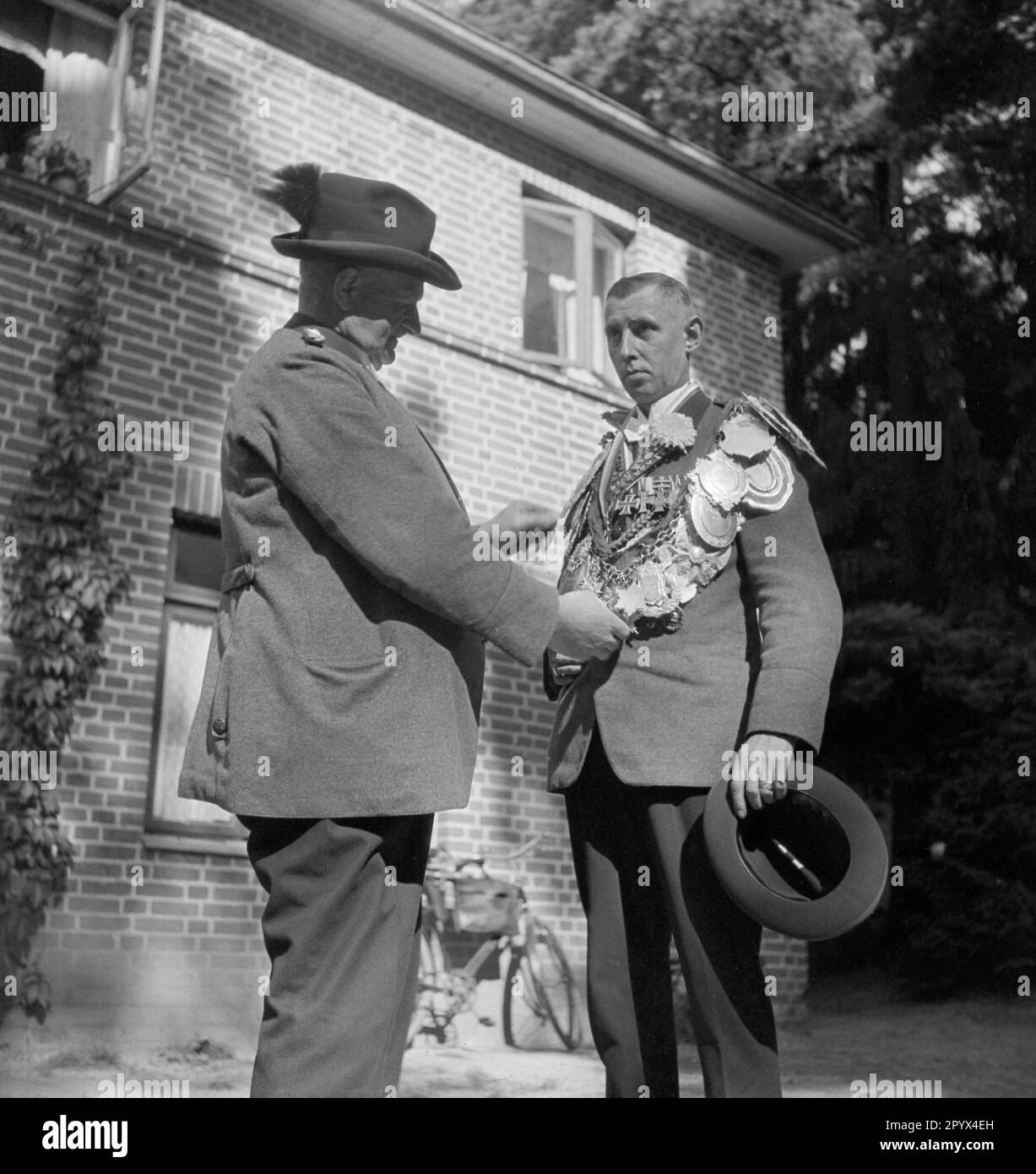 Undated photograph of two members of a Rostock shooting club in uniform
