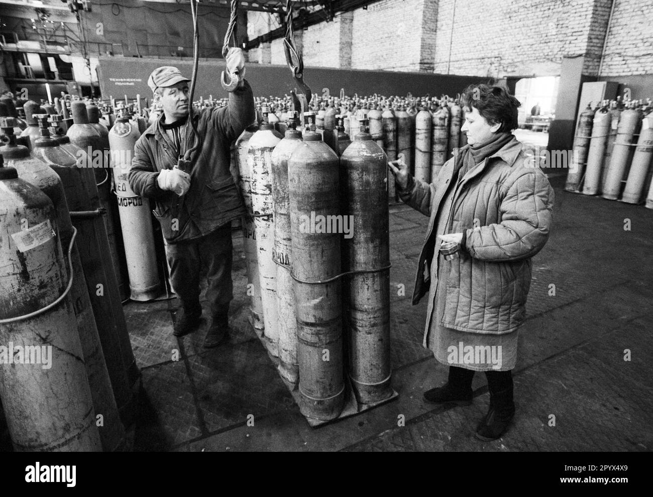 BLR , BELARUS : A woman and a man are working in a gas factory in Minsk 14.02.1995 Stock Photo