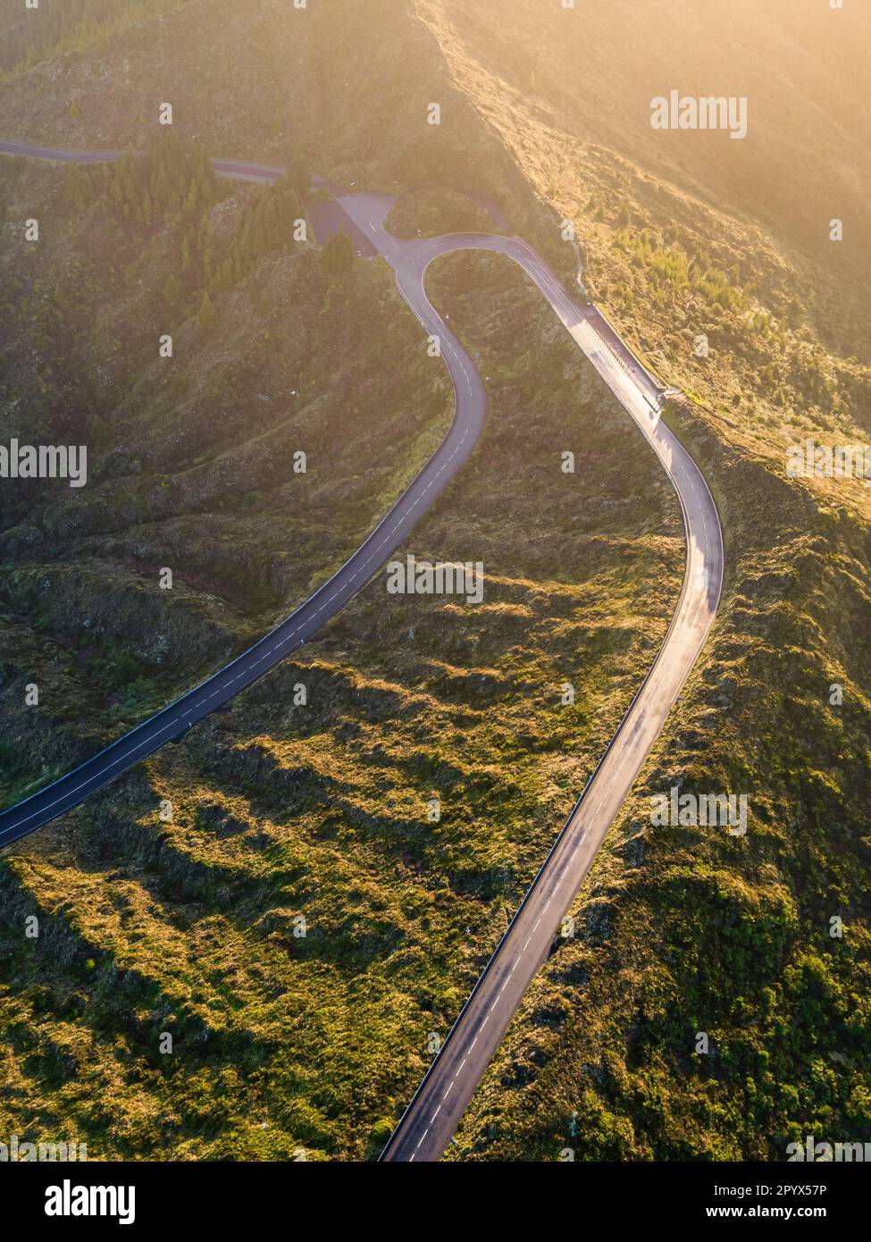 Aerial view of curved asphalt road on the mountain Stock Photo - Alamy