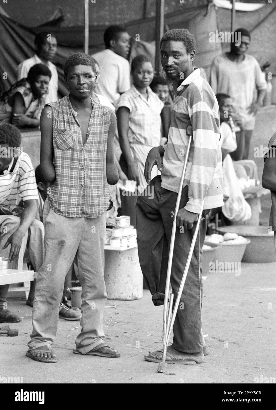 AGO , ANGOLA Maimed former soldiers in Luanda , they are victims of