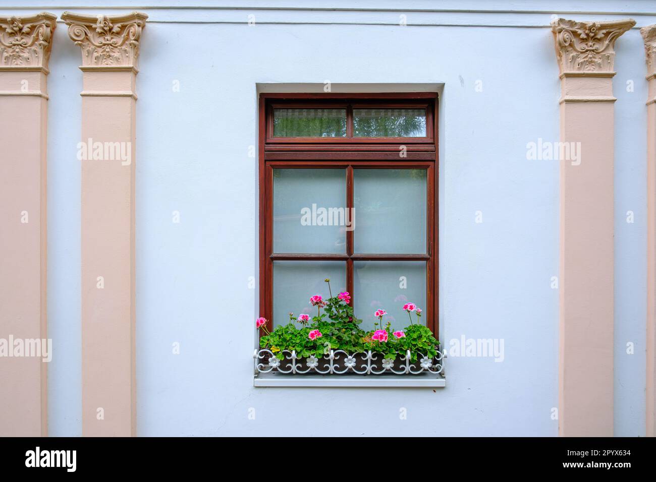 Window of a noble architecture decorated with flowers in the villa district of Sassnitz, Mecklenburg-Western Pomerania, Rugen Island, Germany, Europe. Stock Photo