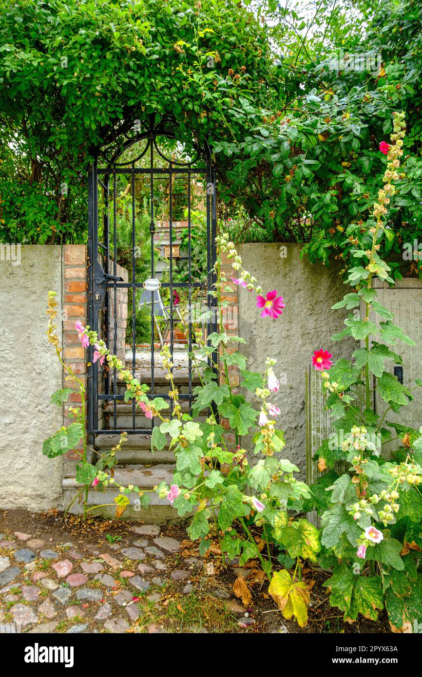 Yard gate with private sign to a small garden in the villa district of Sassnitz, Mecklenburg-Western Pomerania, Rugen Island, Germany, Europe. Stock Photo