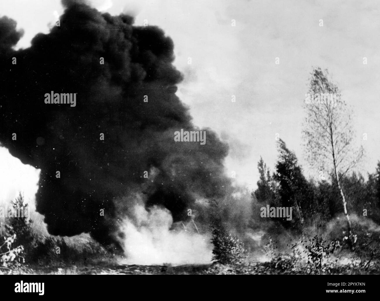 Waffen SS soldiers attack a Russian position with flamethrowers. Photo ...