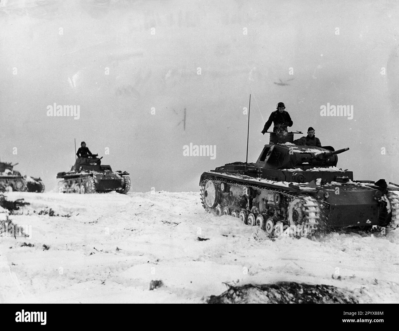 German tanks during a demonstration at a school. In front a Panzer III, behind it Panzer I. The Panzer III is a version B or C with eight rollers. [automated translation] Stock Photo