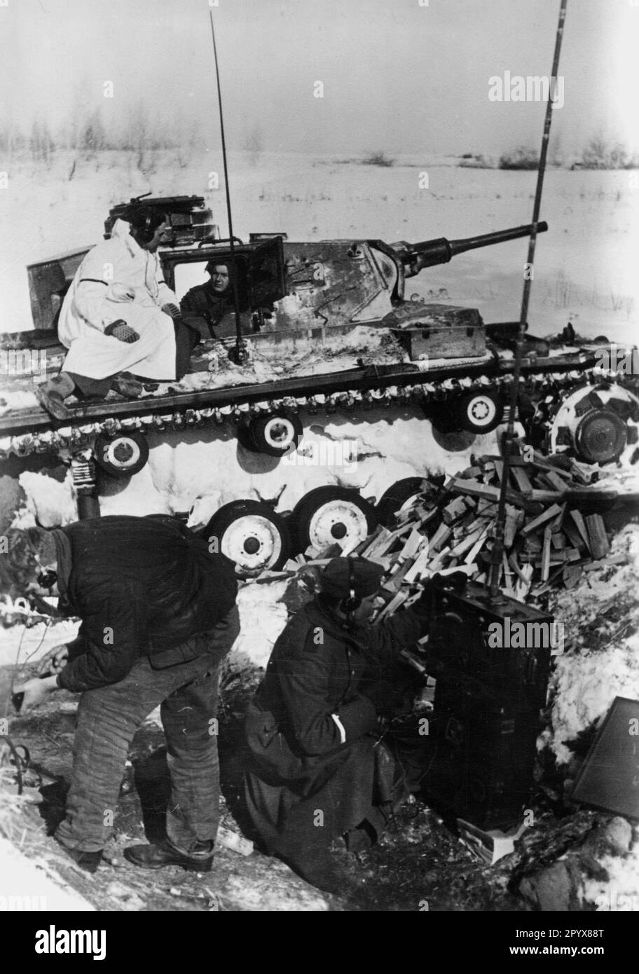 German radio station next to a Panzer III during fighting on the Eastern Front. Photo: Lachmann. [automated translation] Stock Photo