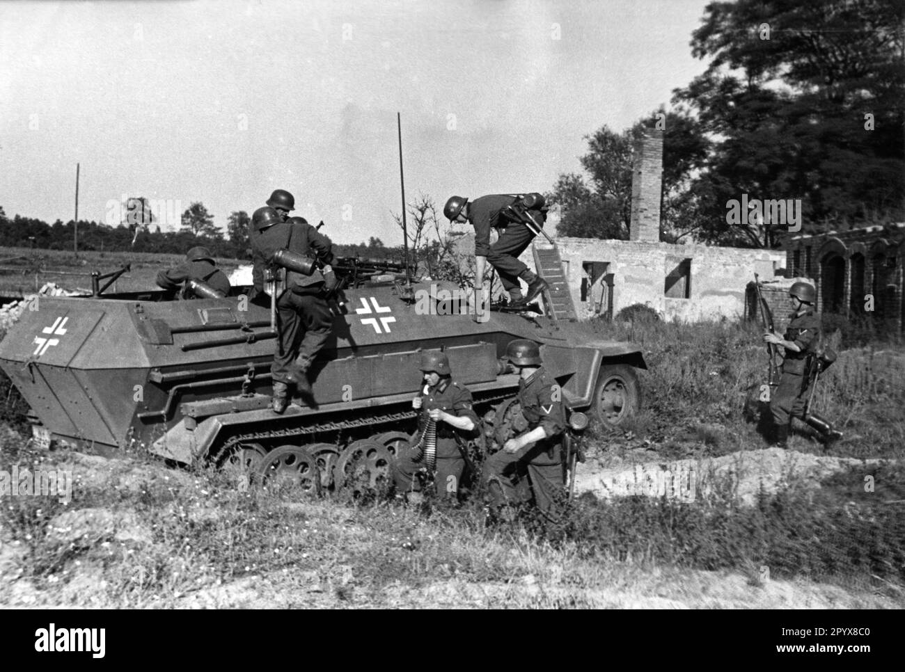 Wehrmacht infantry fighting vehicle during a demonstration, presumably at a military training area in Germany. Infantrymen are sitting down. Photo: Schwahn [automated translation] Stock Photo