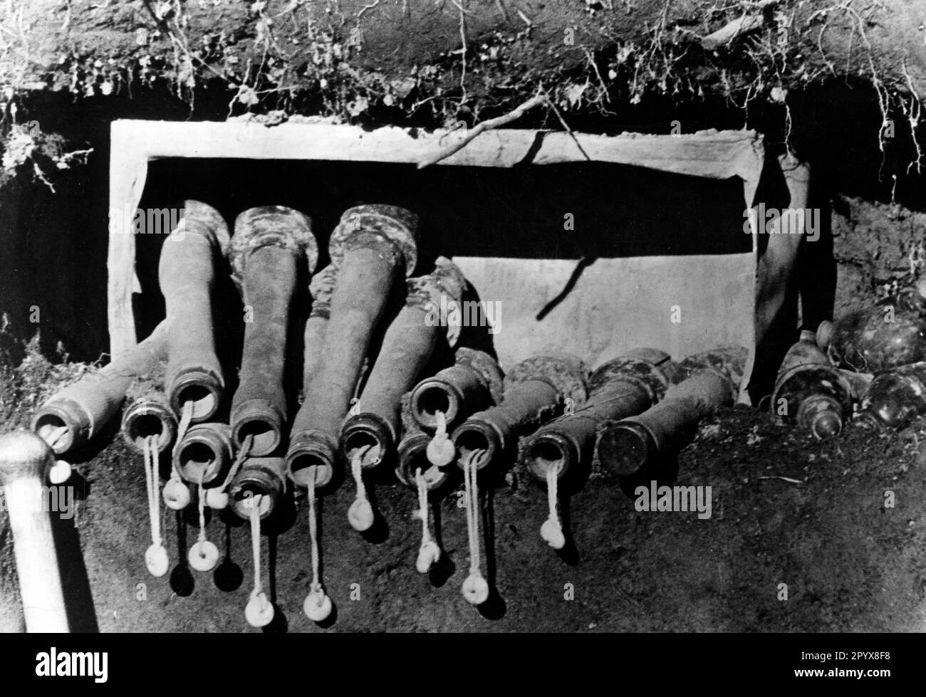 Stick grenades and egg hand grenades in the wall of a German trench on the Eastern Front. Photo: Götz [automated translation] Stock Photo