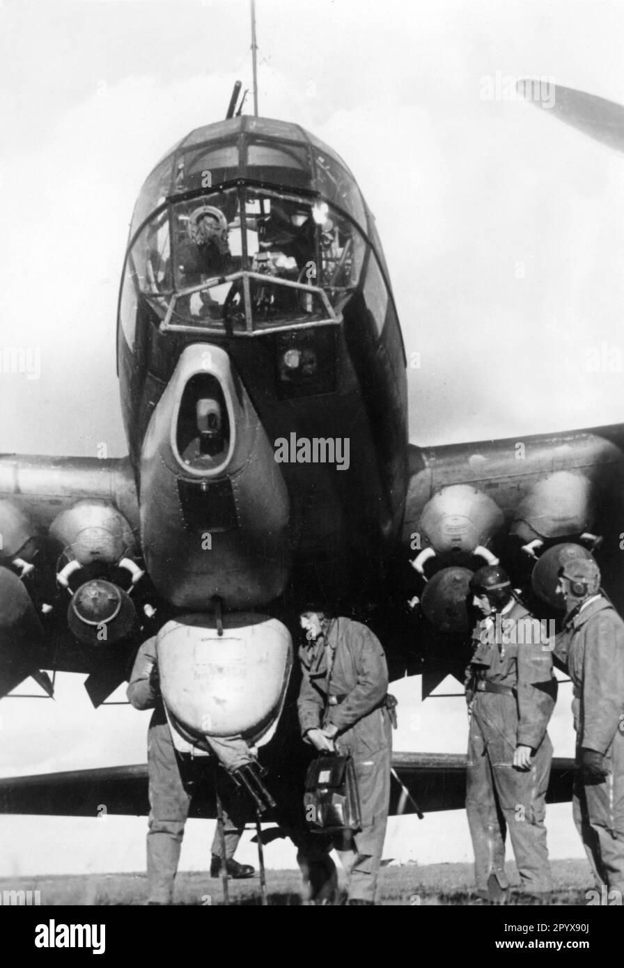 The crew of a German Junkers Ju 88 fighter plane boards the aircraft ...