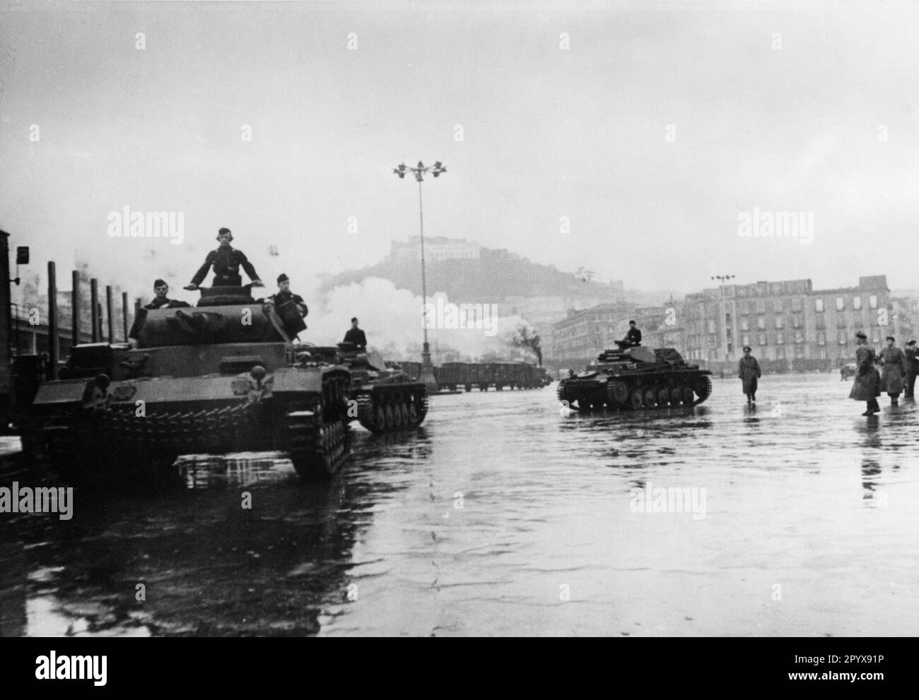 German armored fighting vehicles III (foreground) and II (background) enter an Italian port for loading and transfer to Tripoli. Photo: Moosmüller [automated translation] Stock Photo