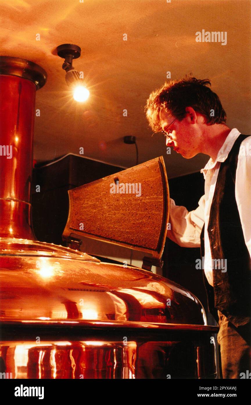 Master brewer Thomas Lindener at one of his brewing kettles, in which