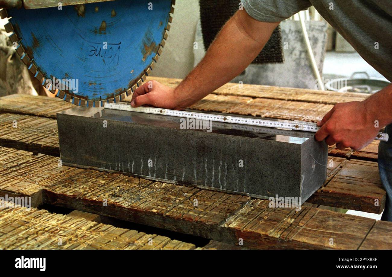 Cut Stone Assembly Date of recording: 15.09.1999 Cutting a block of stone in a stonemason ...