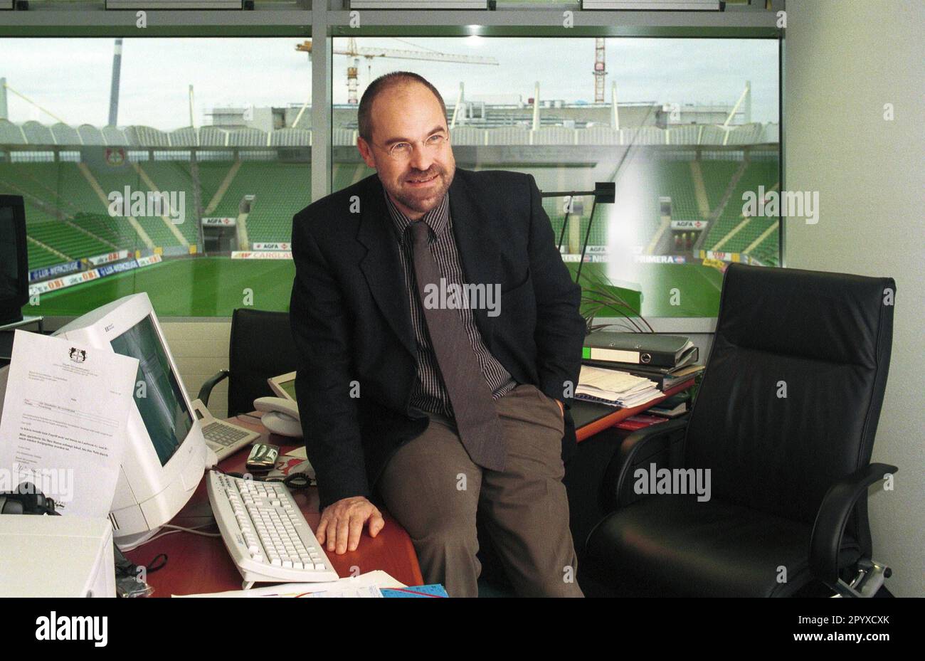 Wolfgang Holzhäuser, Managing Director of Bayer Leverkusen in his office. In the background the stadium of Bayer Leverkusen.nnn [automated translation] Stock Photo