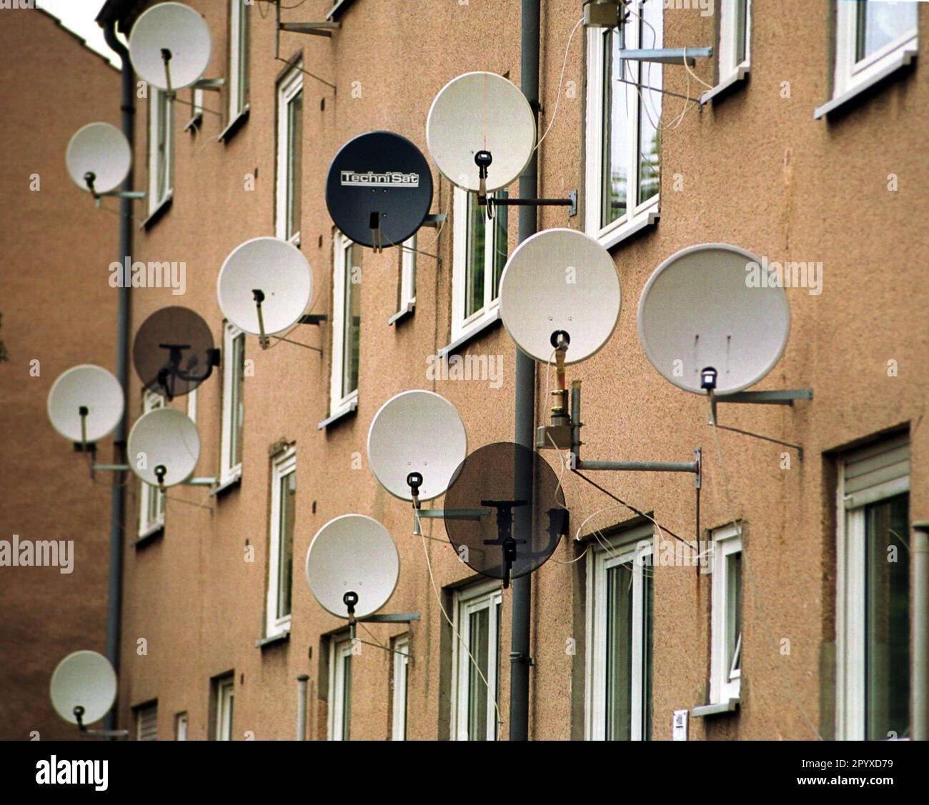Residential house with satellite dishes. [automated translation] Stock