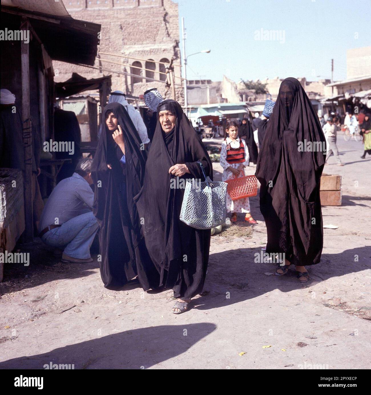 Veiled women shopping in the streets of Samarra. Stock Photo