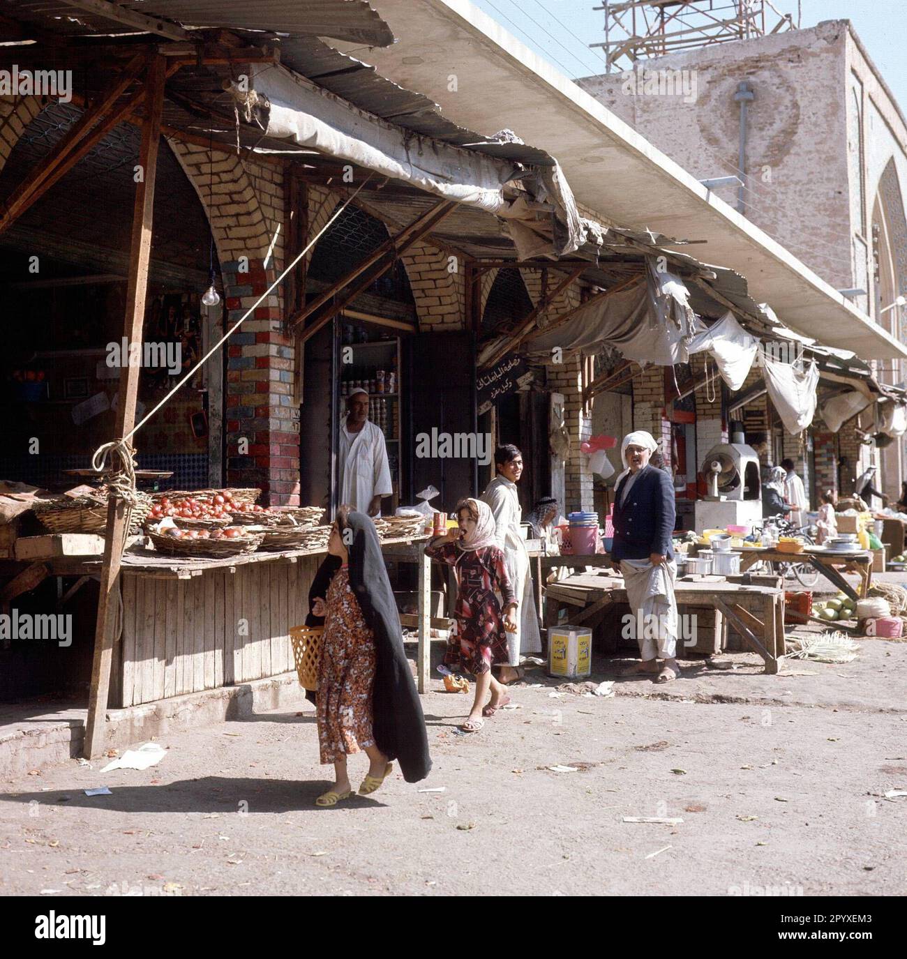 Little girl shopping on the street market of Samarra. Stock Photo