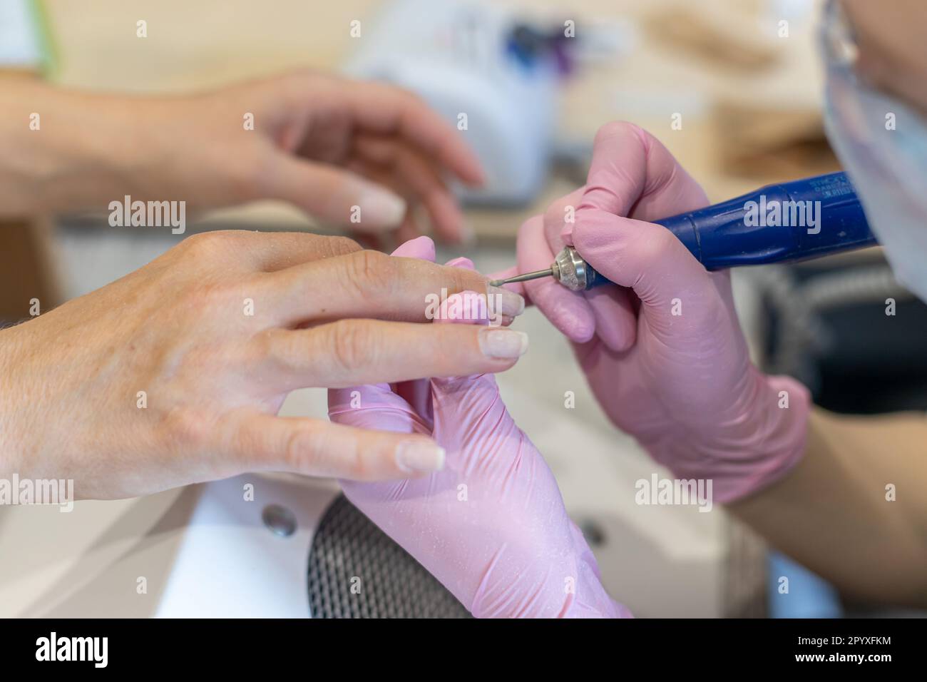 Nails manicure detail with file or brush item. Woman beautiful nail