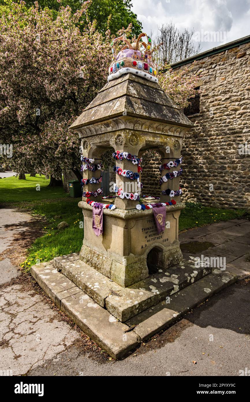 Tribute to coronation of King Charles on 6th May 2023, with street and property decorations in the village of Long Preston in North Yorkshire. Stock Photo