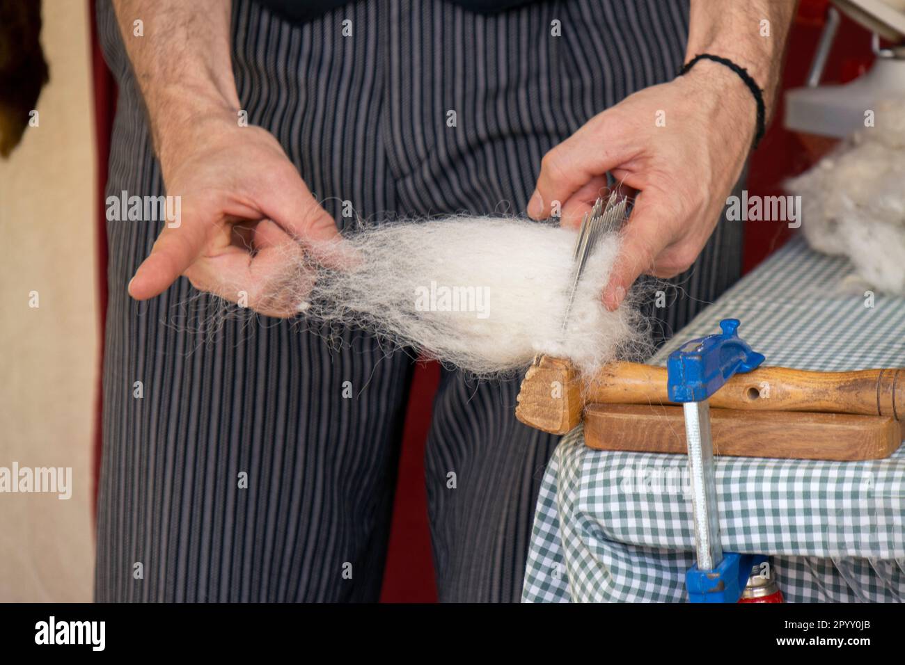Raw fleece and carding for spinning Stock Photo Alamy
