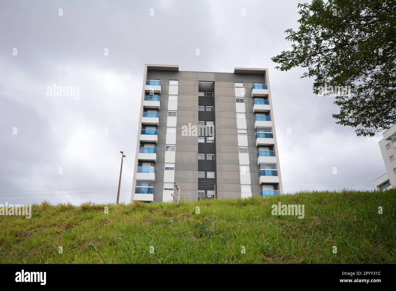 Apartment building, front view, cloudy sky, Brazil, South America, wide angle, bottom-up view Stock Photo