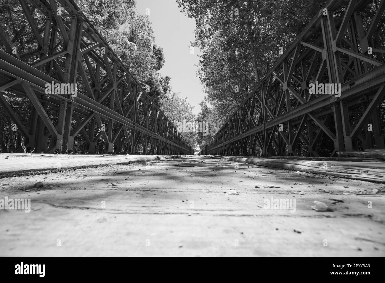 Timeworn and timeless An old bridge with wooden planks and iron