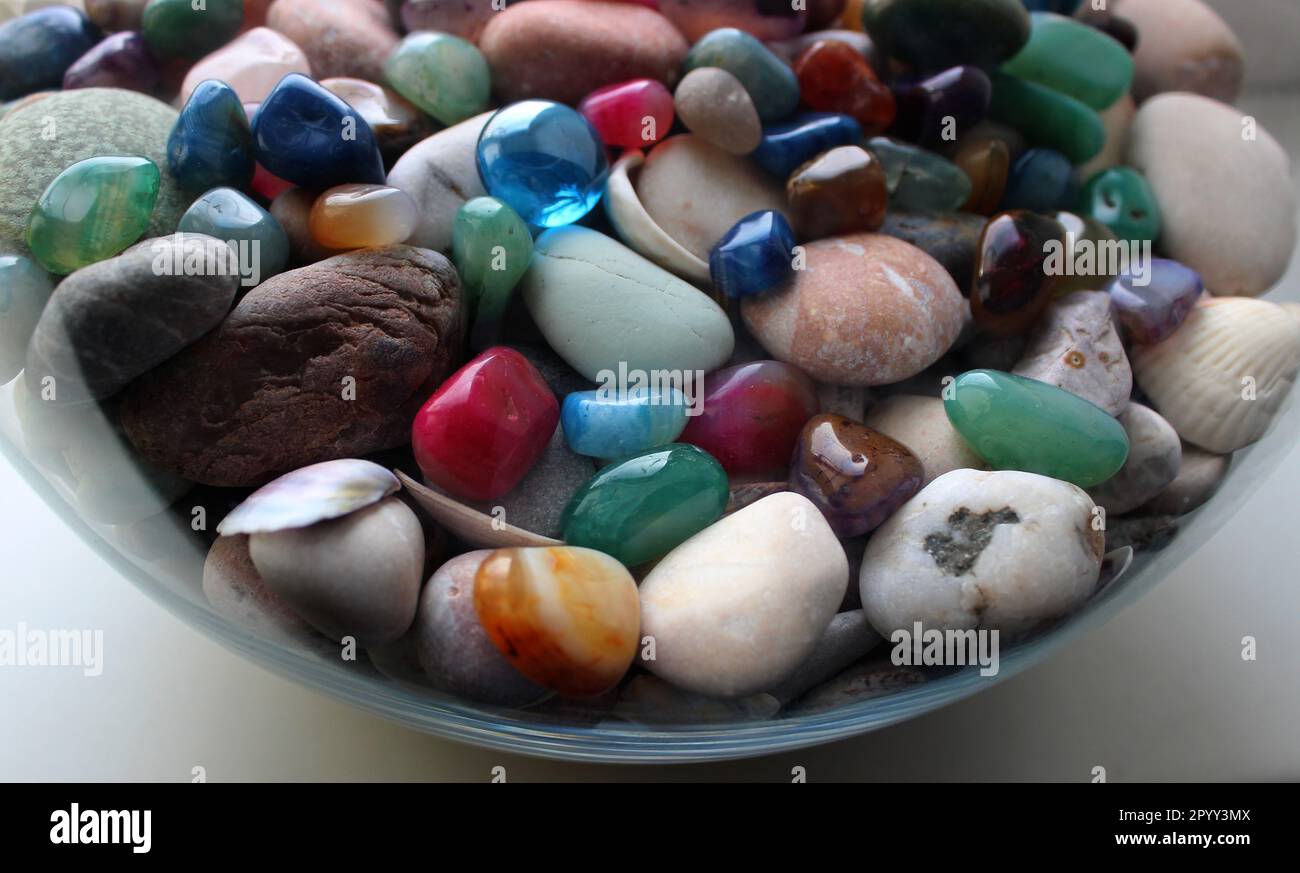 Small sea stones in a glass vessel. The idea of decorating the