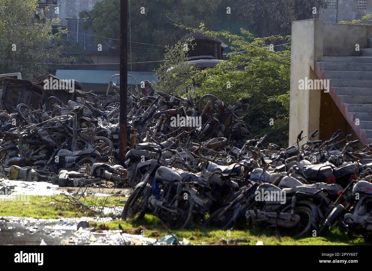 Impounded vehicles are ruining at Risala Police Station, showing the negligence of concerned authorities, in Karachi on Friday, May 5, 2023. According to rules impounded vehicles must be auction by government every year but from 1992 Government did not auction any vehicle. Stock Photo