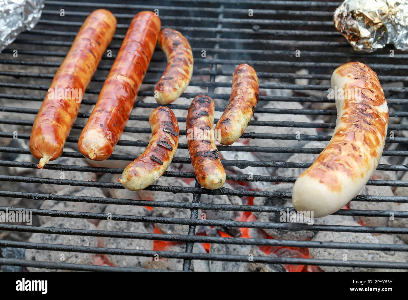 sausages on the charcoal grill Stock Photo