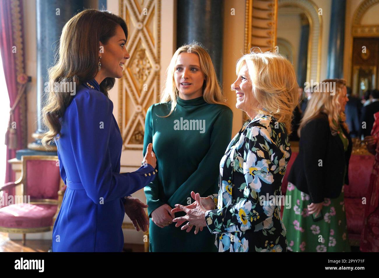 The Princess of Wales speaks (left) talks with the First Lady of the United States, Dr Jill Biden and her grand daughter Finnegan Biden, during a reception at Buckingham Palace, in London, for overseas guests attending the coronation of King Charles III. Picture date: Friday May 5, 2023. Stock Photo