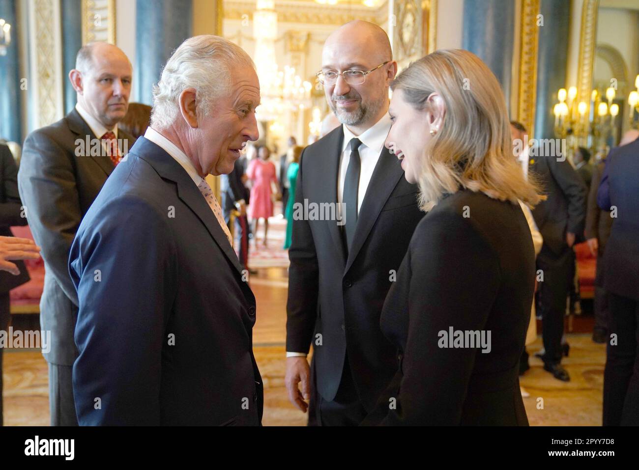 King Charles III (left) speaks to the First Lady of Ukraine Olena Zelenska and the Prime Minister of Ukraine, Denys Shmyhal, during a reception at Buckingham Palace, in London, for overseas guests attending his coronation. Picture date: Friday May 5, 2023. Stock Photo