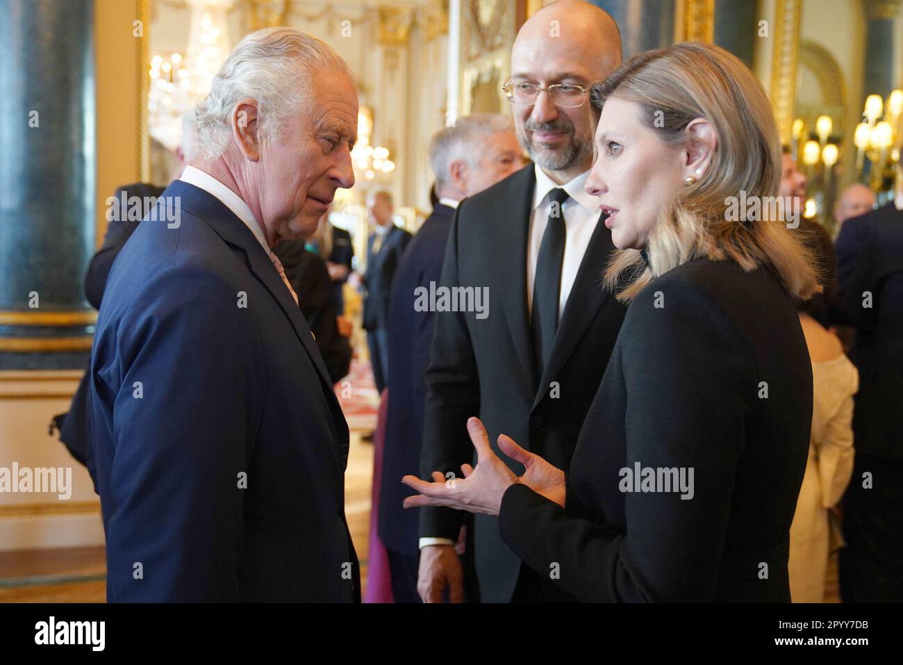 King Charles III (left) speaks to the First Lady of Ukraine Olena Zelenska and the Prime Minister of Ukraine, Denys Shmyhal, during a reception at Buckingham Palace, in London, for overseas guests attending his coronation. Picture date: Friday May 5, 2023. Stock Photo