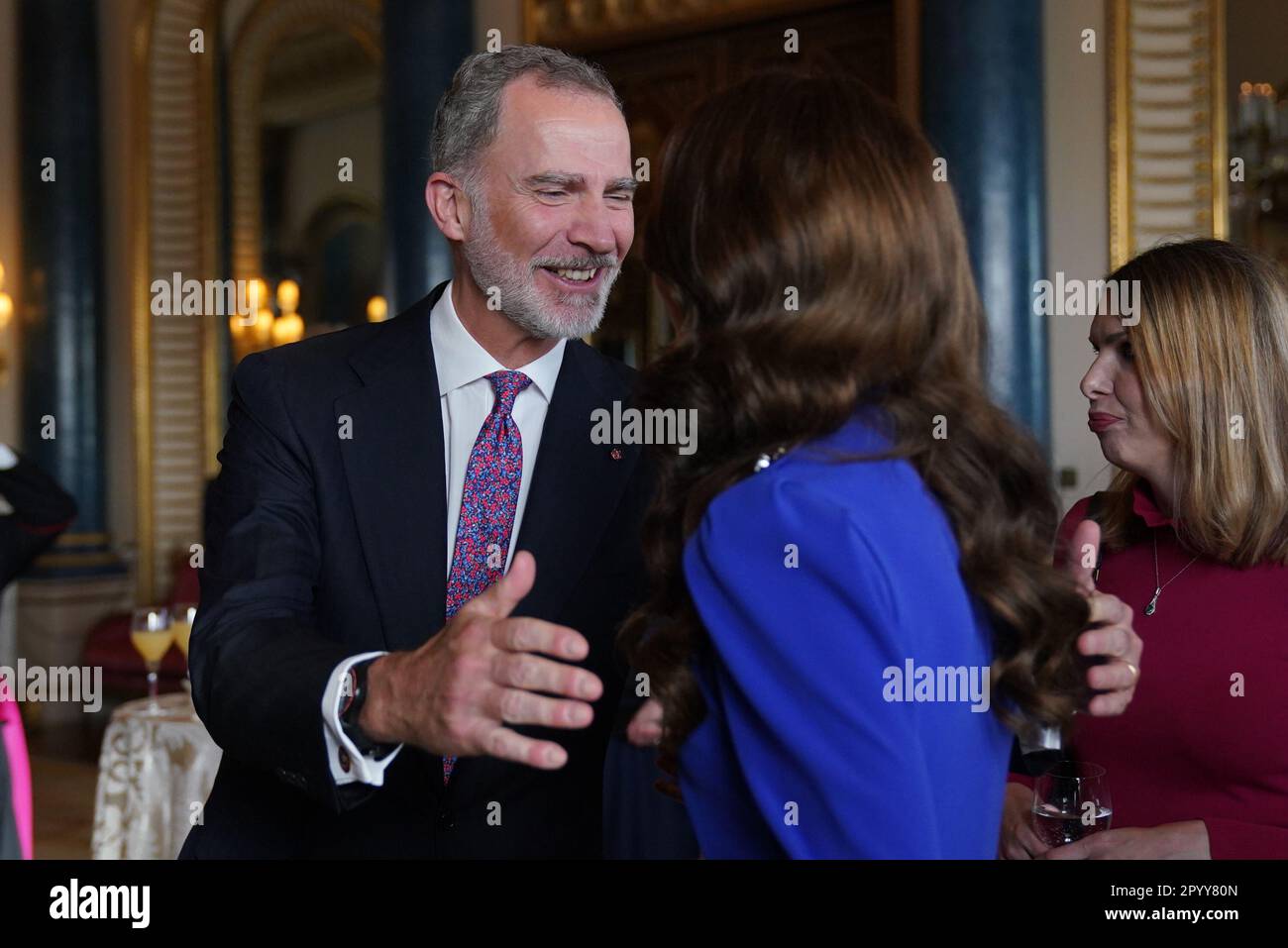King Felipe VI of Spain greets the Princess of Wales, during a reception at Buckingham Palace, in London, for overseas guests attending the coronation of King Charles III. Picture date: Friday May 5, 2023. Stock Photo