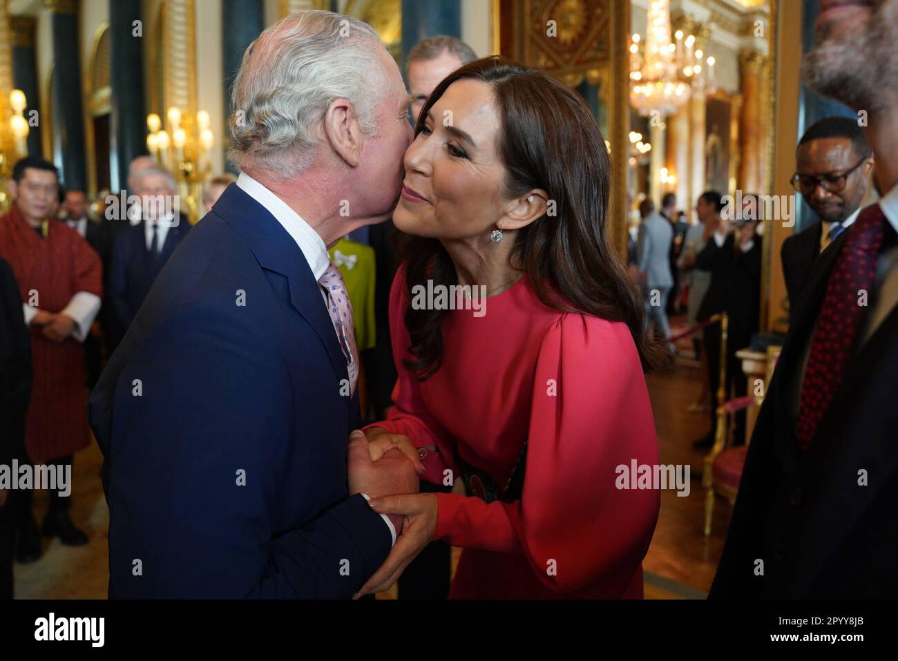 King Charles III (left) greets Mary, Crown Princess of Denmark, during a reception at Buckingham Palace, in London, for overseas guests attending his coronation. Picture date: Friday May 5, 2023. Stock Photo