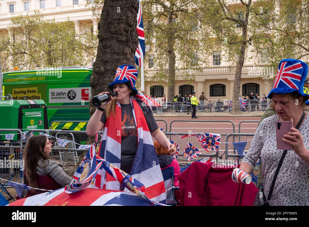 London UK, 5th May 2023. Less than a day away from the Coronation on The Mall people enjoying themselves and celebrating the King Charles III. Credit: Rena Pearl/Alamy Live News Stock Photo