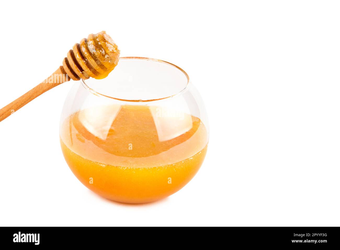 Natural bee honey in a jar isolated on a white background. Free space ...