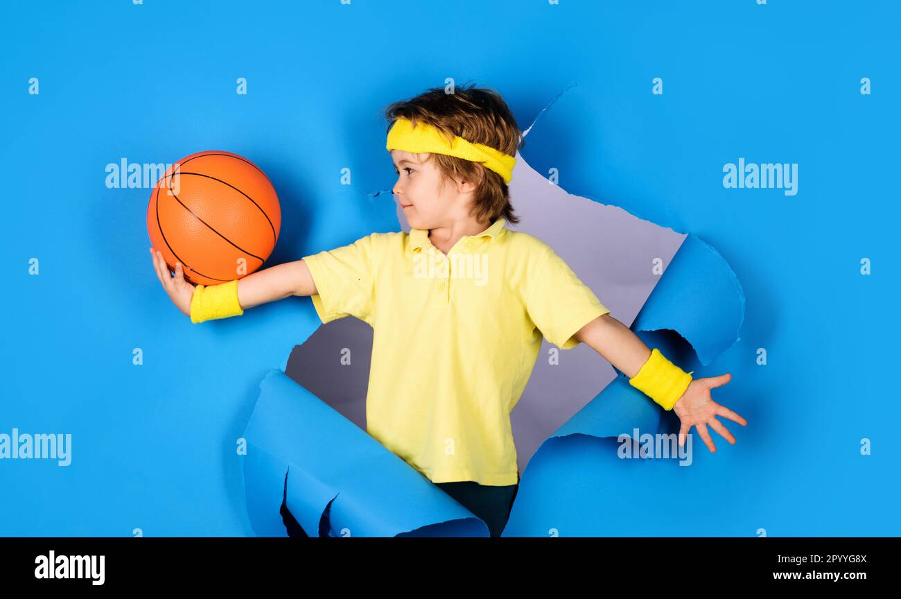 Basketball game. Small basketballer with basketball ball on hand. Sport equipment. Active sport