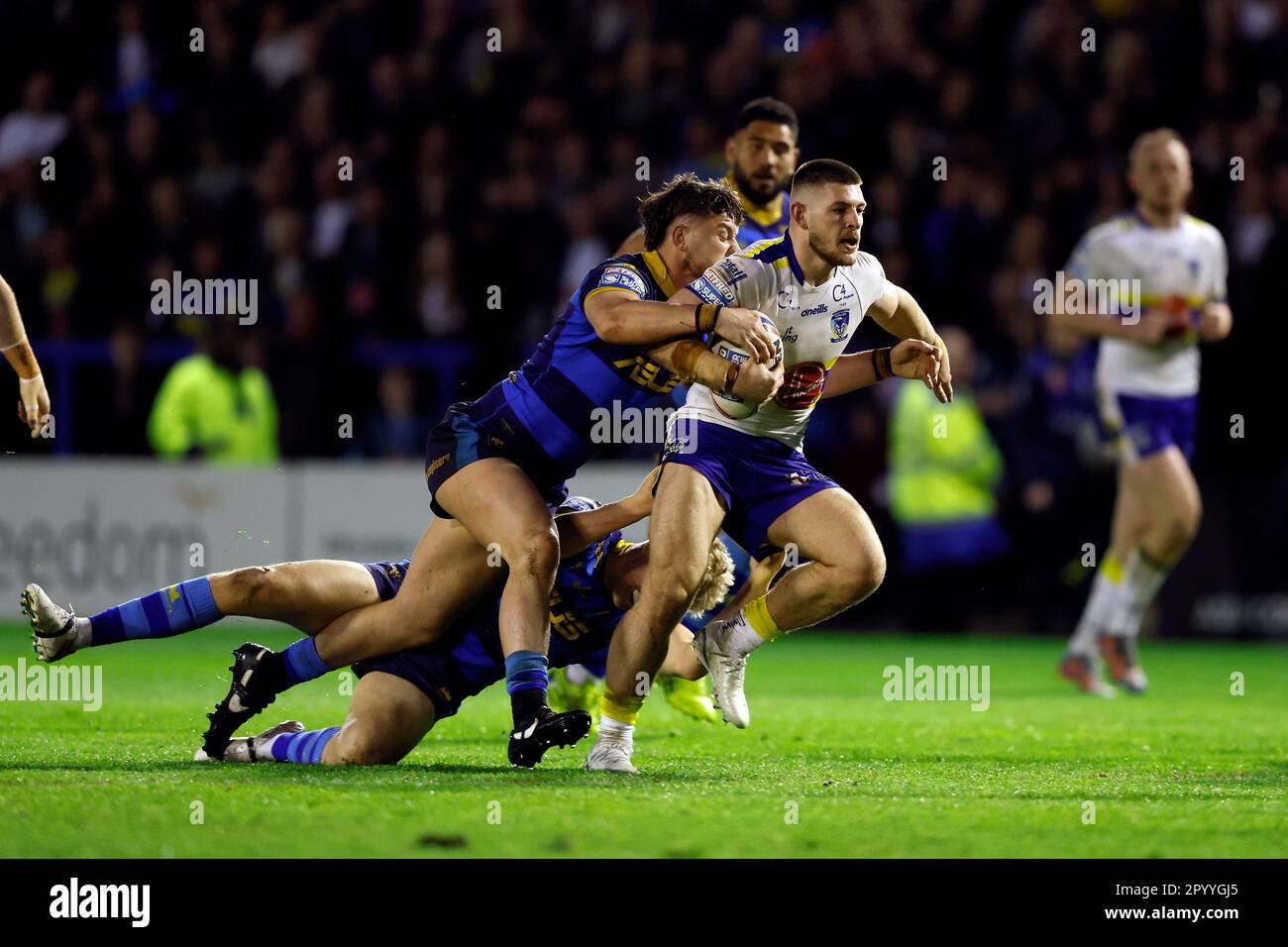 Warrington Wolves' Danny Walker is tackled during the Betfred Super League match at the Halliwell Jones Stadium, Warrington. Picture date: Friday May 5, 2023. Stock Photo