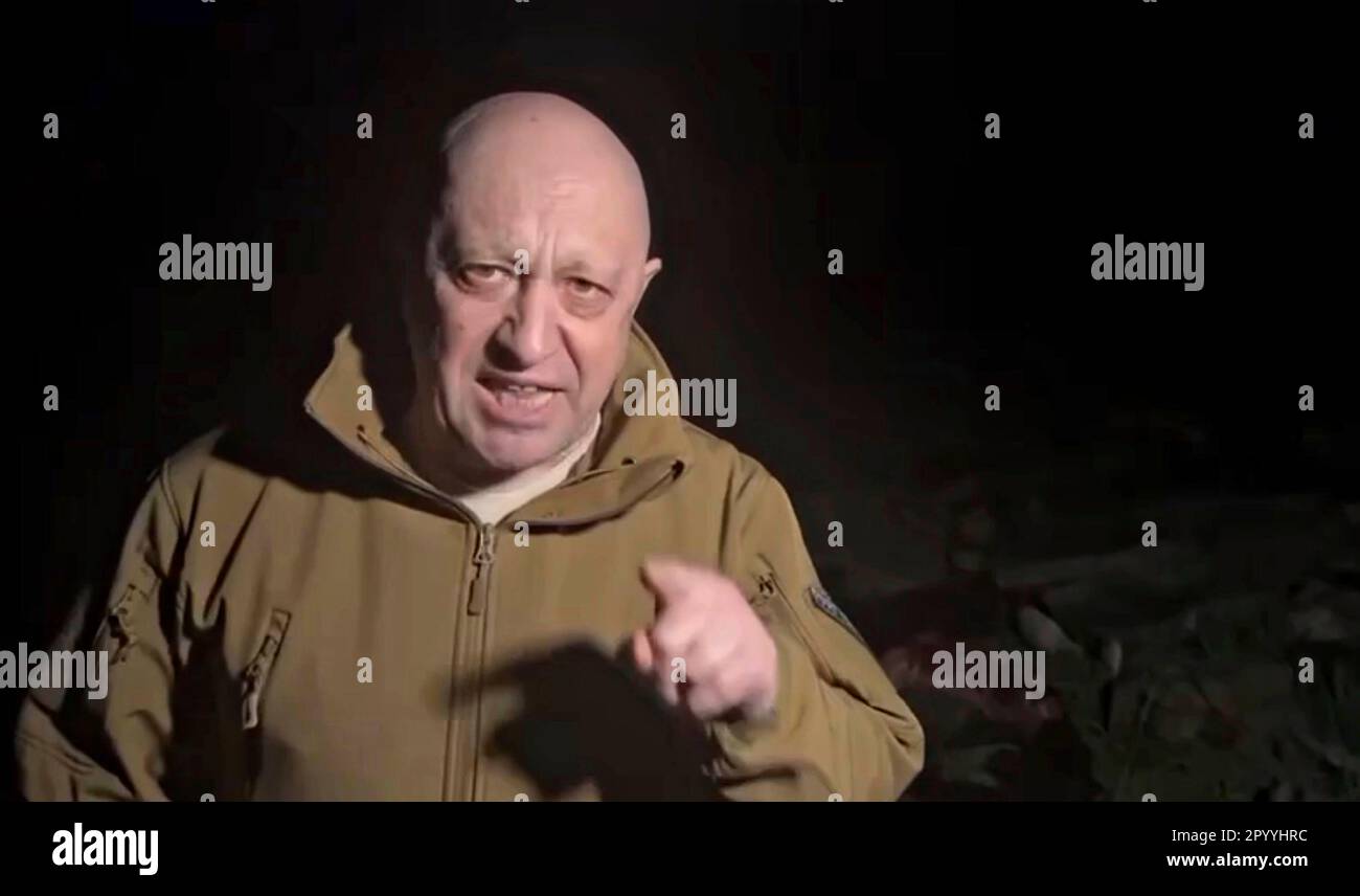 Bakhmut, Ukraine. 05th May, 2023. Russian Yevgeny Prigozhin, owner of the Wagner Group of mercenaries broadcasts a tirade against Russian Defense Minister Sergei Shoigu accusing the military command of starving his forces of ammunition and supplies, May 4, 2023 near Bakhmut, Ukraine. Prigozhin, standing in a field of bodies of his soldiers killed in battle threatened to withdraw from the frontlines. Credit: Pool Photo/Wagner Group/Alamy Live News Stock Photo