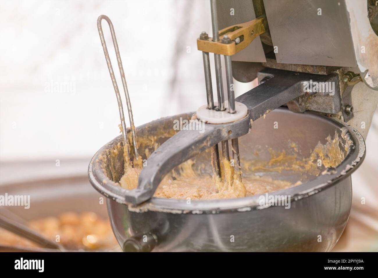 The process of making fresh cookies. Large industrial mixer closeup