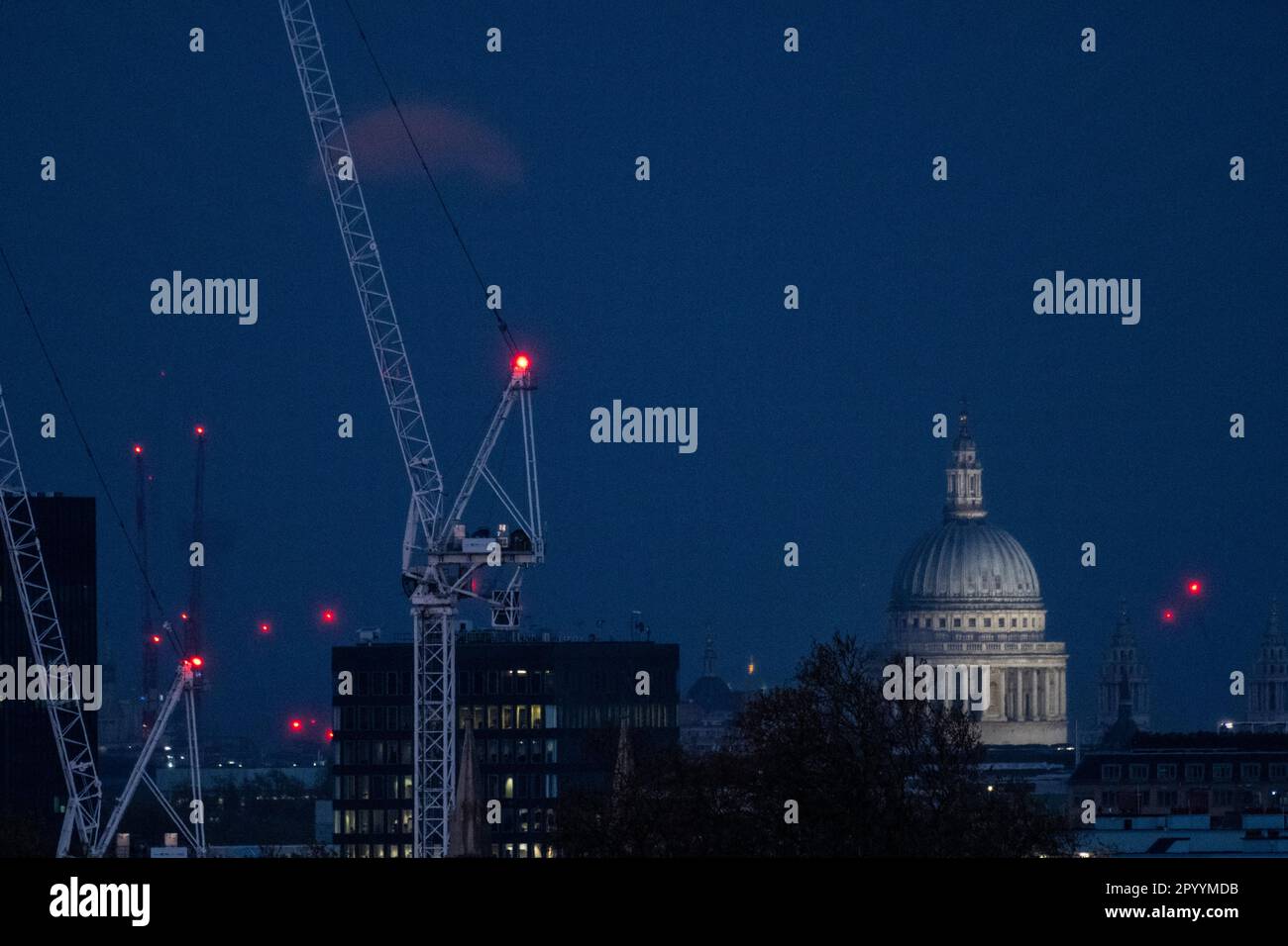 London, UK. 5 May 2023. UK Weather – The Flower Moon rises to the left ...