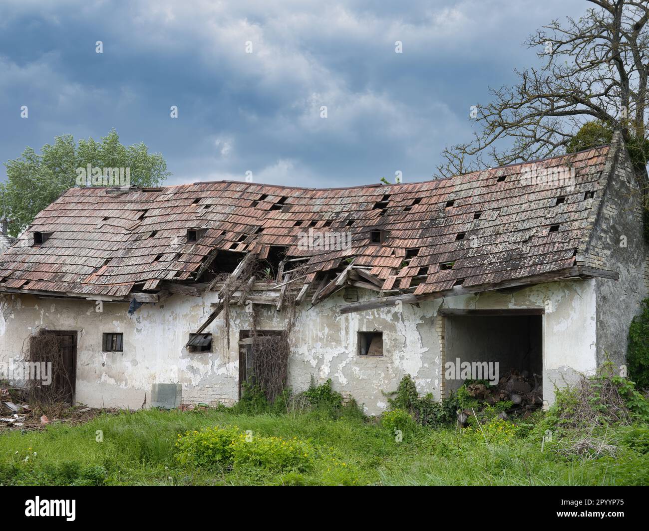 Exterior of the ruins of an old village abandoned house with a ruined ...