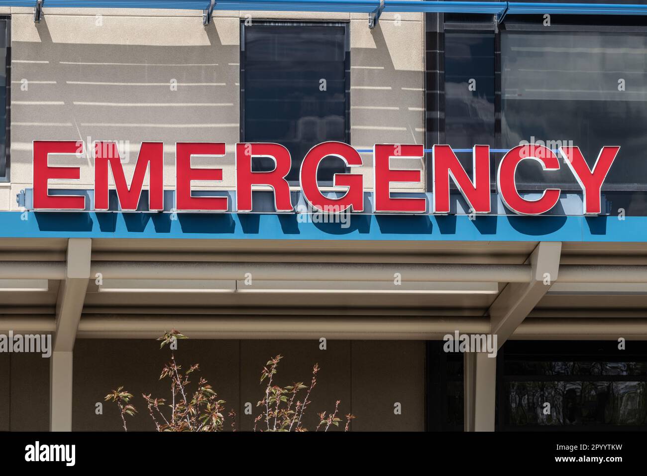 Emergency Room and Emergency Department entrance sign for a hospital in alert red. Stock Photo