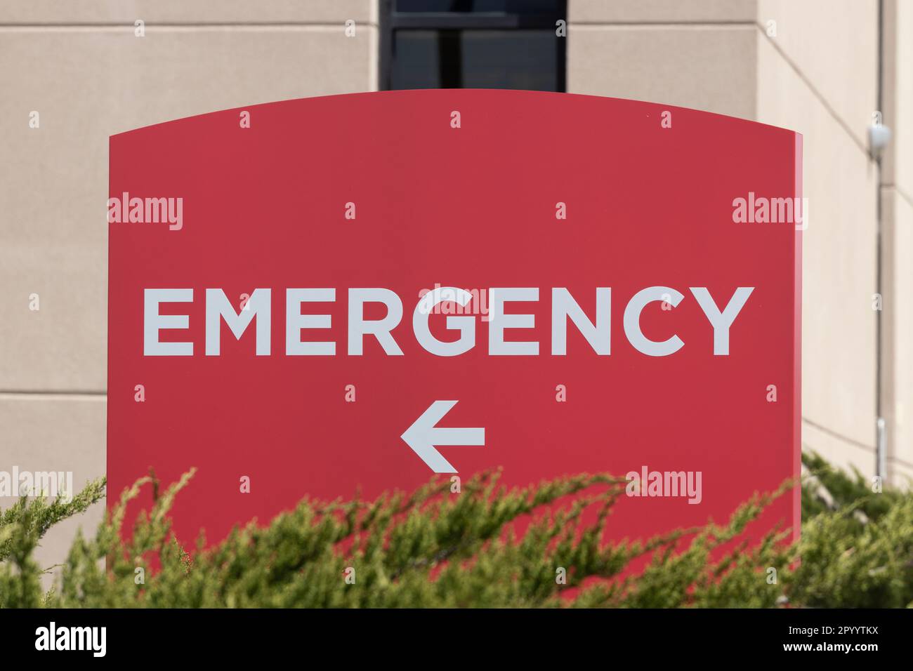 Emergency Room and Emergency Department entrance sign for a hospital in alert red. Stock Photo