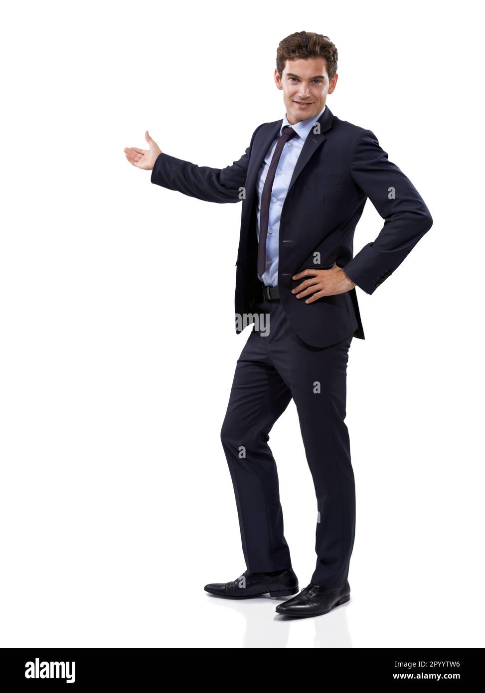 Introducing the brand youve all been waiting for. Studio shot of a well dressed businessman showing you copyspace against a white background. Stock Photo