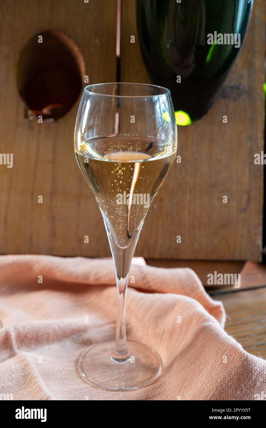 Glass of sparkling white wine champagne gran cru or cava with bubbles