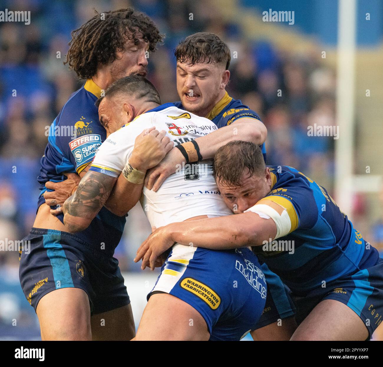 Warrington, Cheshire, England 5th May 2023. Warrington’s Paul Vaughan tackled by Wakefield players, during Warrington Wolves Rugby League Football Club V Wakefield Trinity Rugby League Football Club at the Halliwell Jones Stadium, the Betfred Super League. (Credit Image: ©Cody Froggatt/Alamy live news) Stock Photo